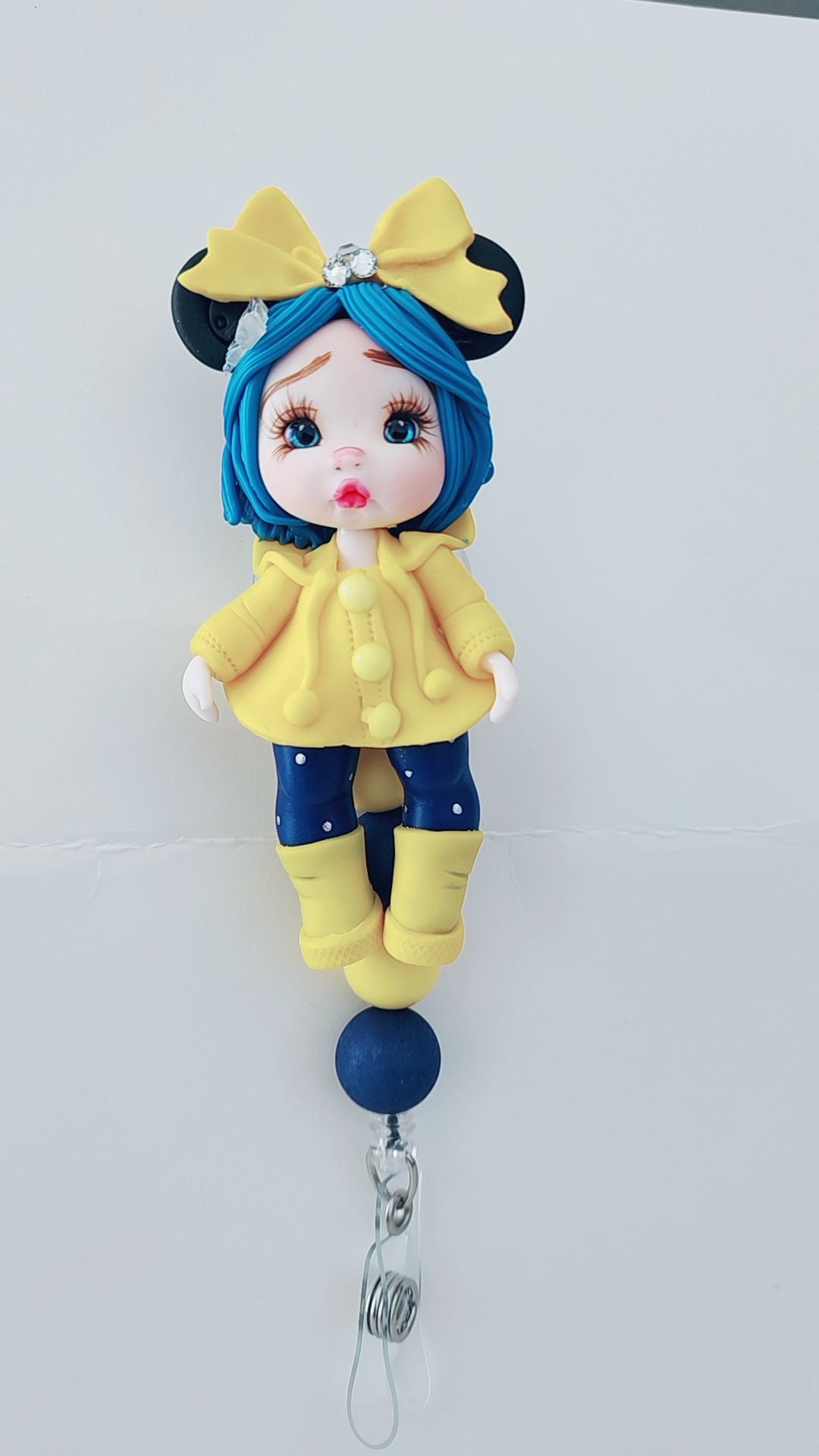 ✨ Blue Hair Cutie in Yellow Raincoat Badge Reel – Handmade Clay Character ✨
